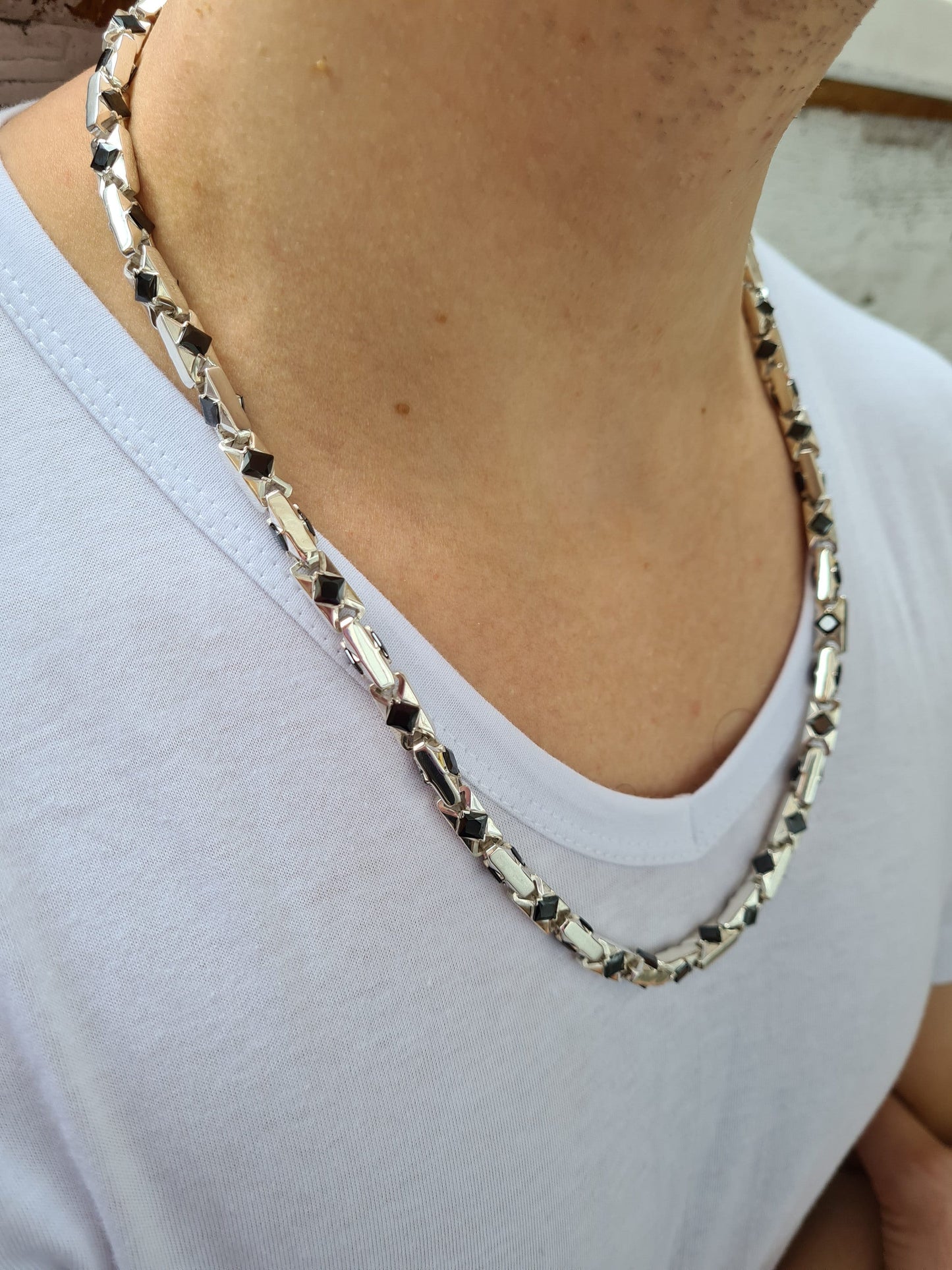 handmade men's necklace with agate stones on a man