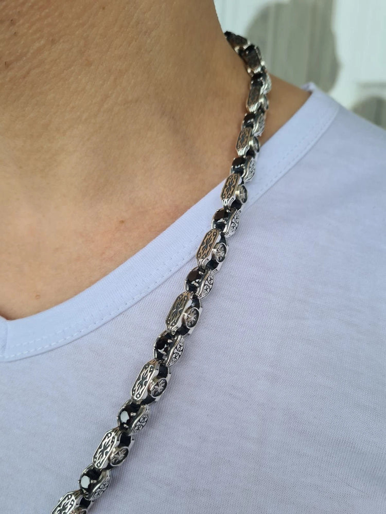 Silver chain with agate stones on a man