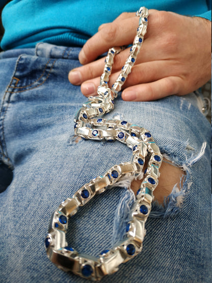 Silver chain with blue inserts close-up