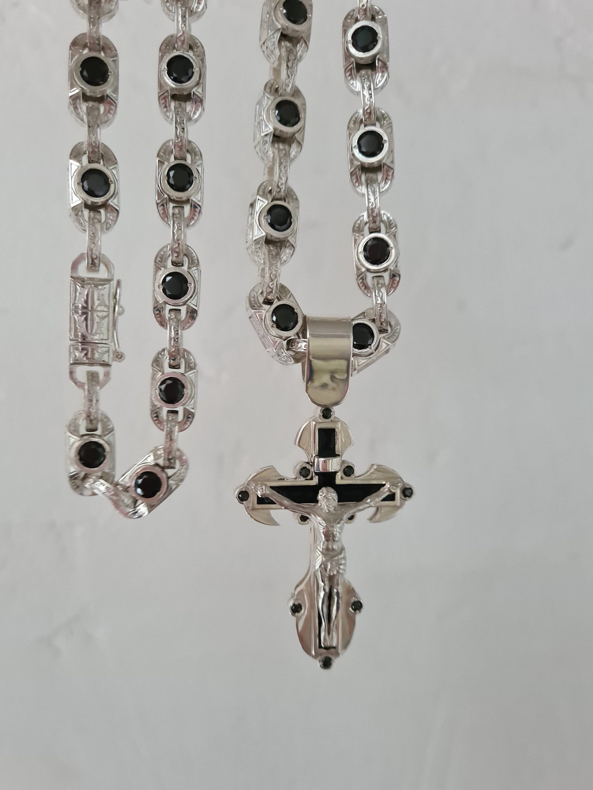 Silver cross pendant with a massive chain