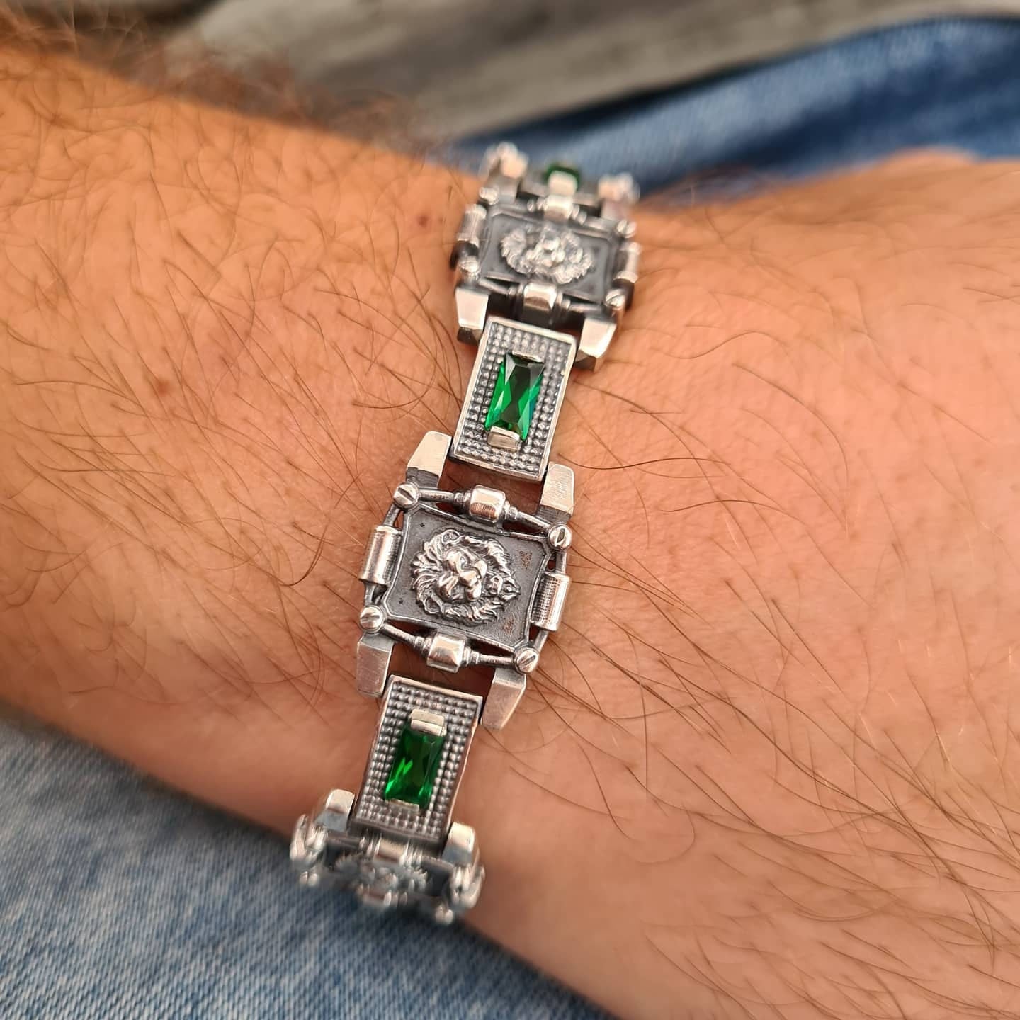 Detailed lion heads on a massive bracelet
