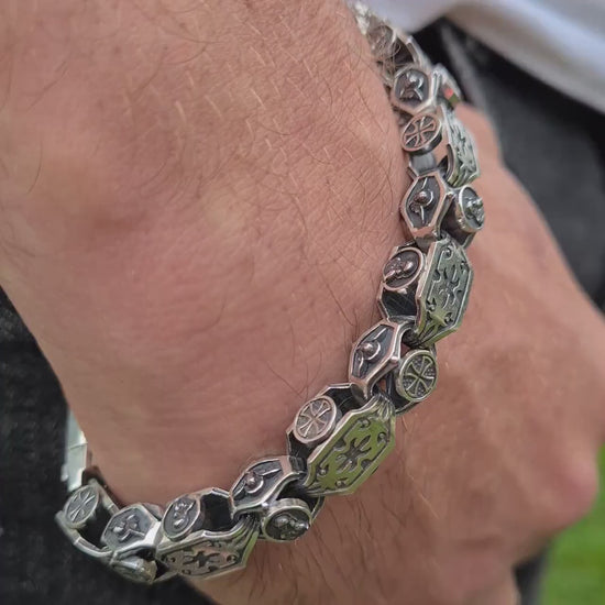 silver jewelry with an engraving of the Virgin Mary