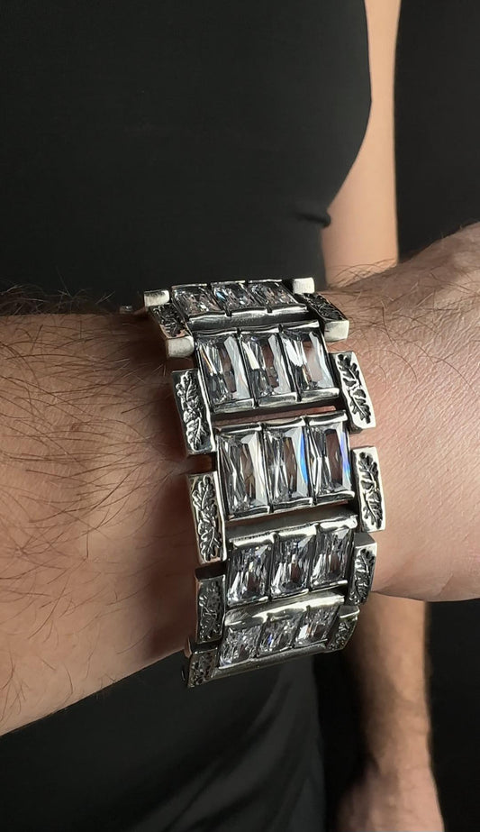 Silver bracelet with stones, designed for wristwatch, on the wrist