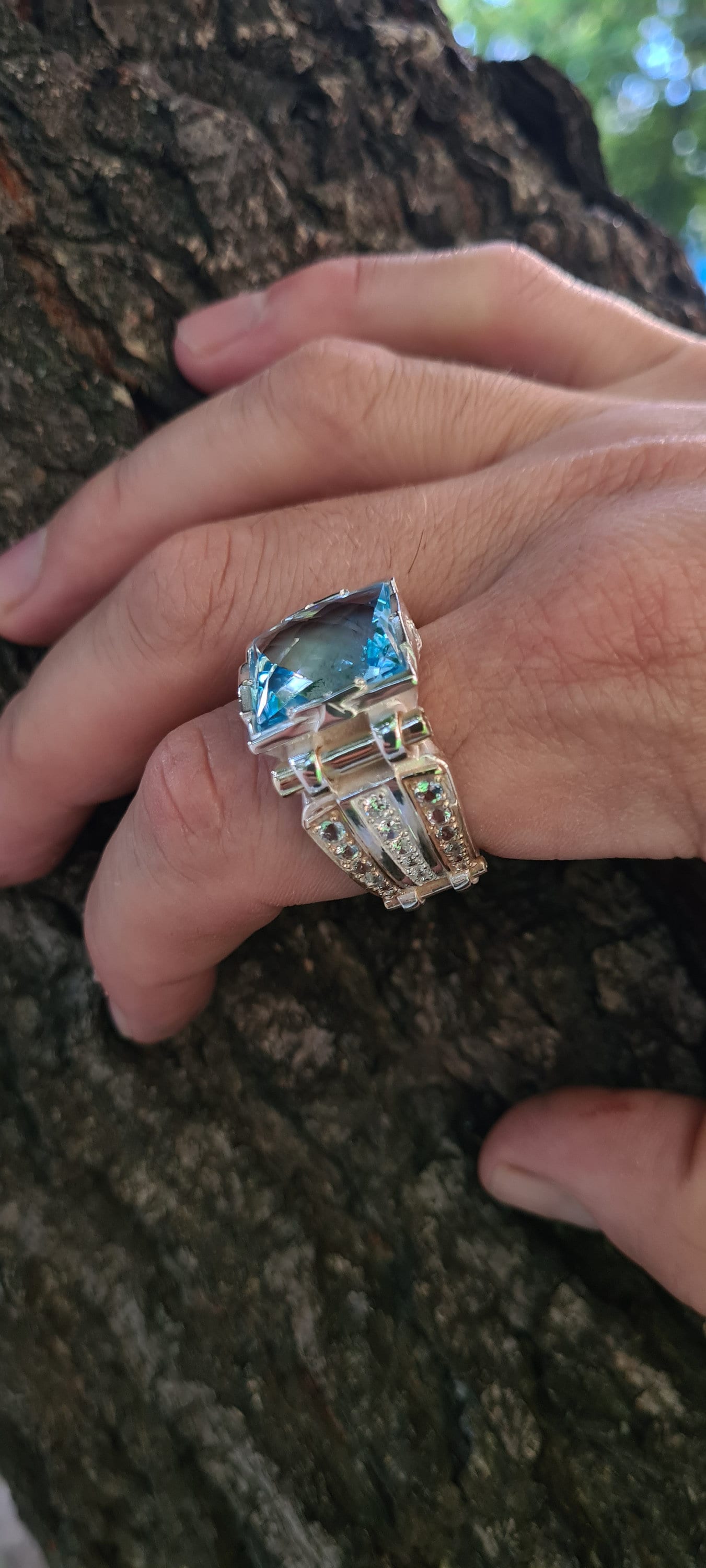 Bold men's gemstone ring with natural topaz and gold detailing

